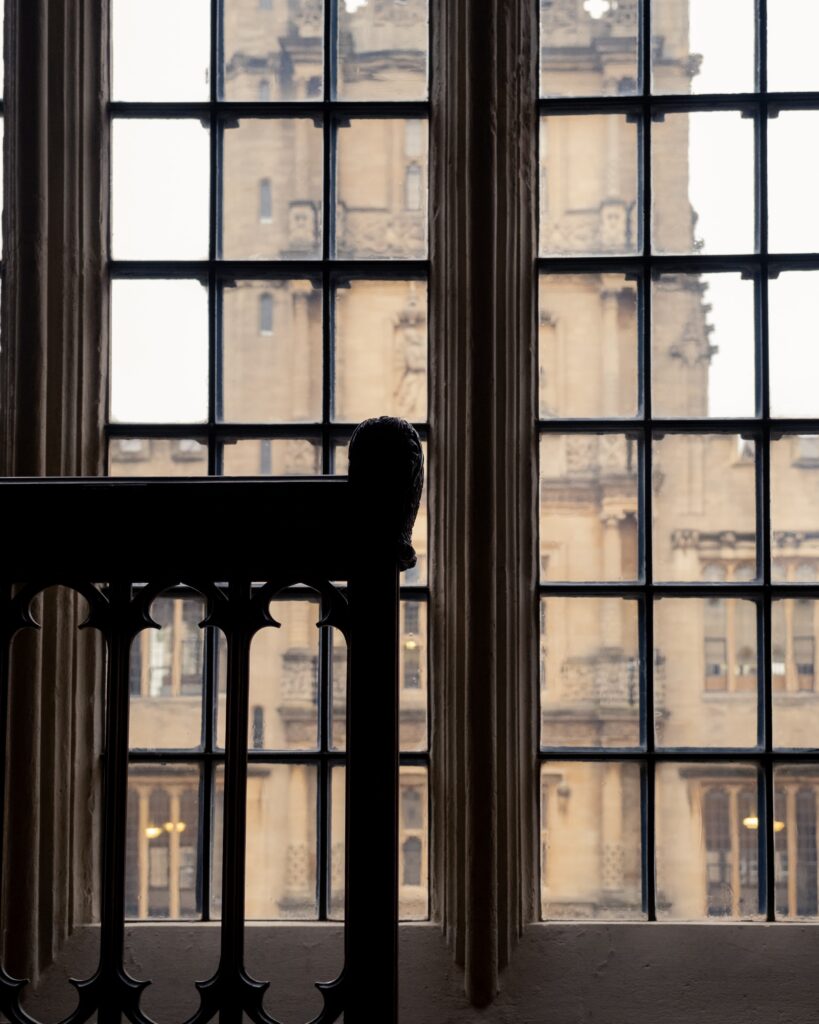detail of a window and a chair inside the old library of London